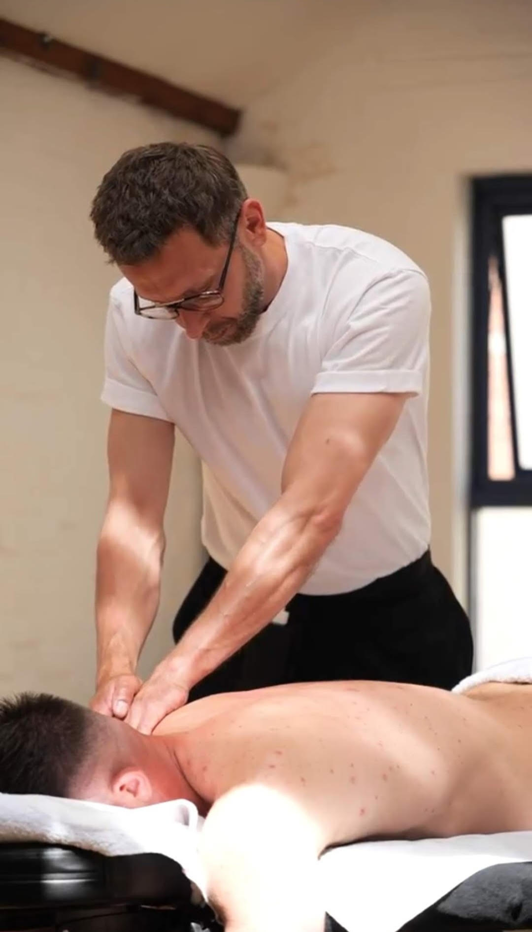 holistic massage with patient on massage table